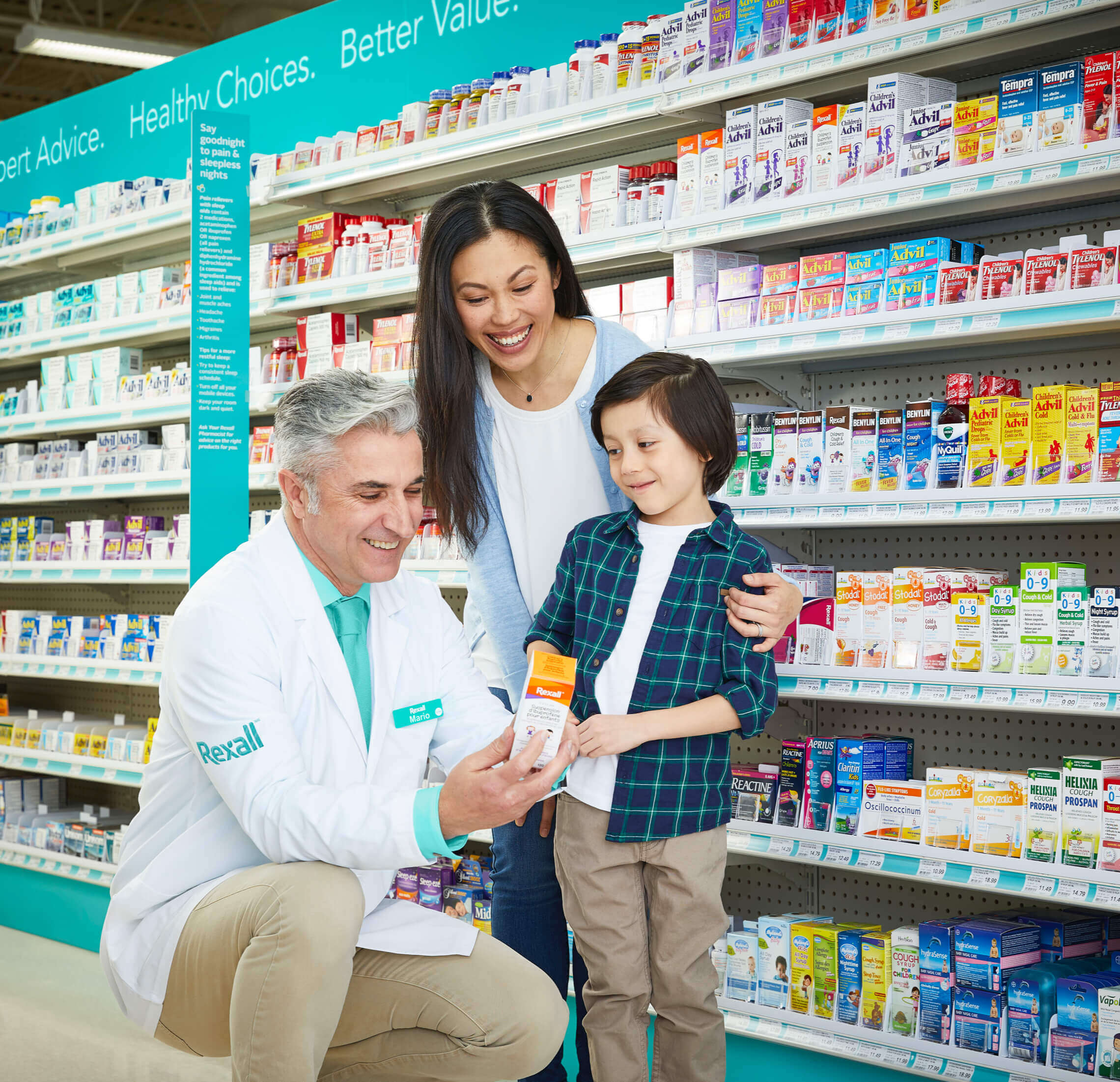 Pharmacist helping a family in a Rexall store